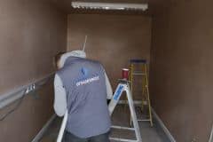 electrician install lighting at shop